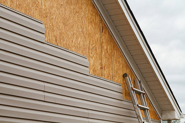 Professional Siding Installation technician working in New Concord, OH